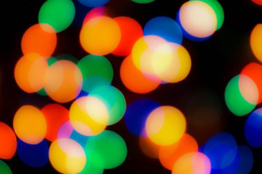 Soyut renkli, odaklanmış dairesel fakül. Bokeh bulanık renk ışığı arka planı kullanabilir. Yeni yıl Bokeh feshi