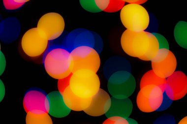 Soyut renkli, odaklanmış dairesel fakül. Bokeh bulanık renk ışığı arka planı kullanabilir. Yeni yıl Bokeh feshi