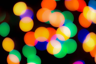 Soyut renkli, odaklanmış dairesel fakül. Bokeh bulanık renk ışığı arka planı kullanabilir. Yeni yıl Bokeh feshi