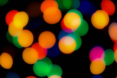 Soyut renkli, odaklanmış dairesel fakül. Bokeh bulanık renk ışığı arka planı kullanabilir. Yeni yıl Bokeh feshi