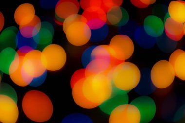 Soyut renkli, odaklanmış dairesel fakül. Bokeh bulanık renk ışığı arka planı kullanabilir. Yeni yıl Bokeh feshi