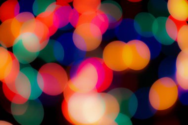 Soyut renkli, odaklanmış dairesel fakül. Bokeh bulanık renk ışığı arka planı kullanabilir. Yeni yıl Bokeh feshi