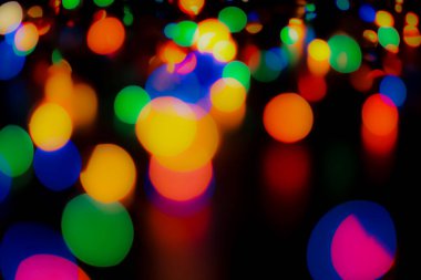 Soyut renkli, odaklanmış dairesel fakül. Bokeh bulanık renk ışığı arka planı kullanabilir. Yeni yıl Bokeh feshi