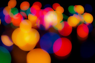 Soyut renkli, odaklanmış dairesel fakül. Bokeh bulanık renk ışığı arka planı kullanabilir. Yeni yıl Bokeh feshi