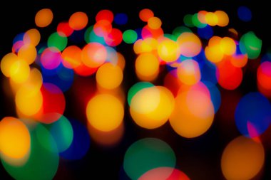 Soyut renkli, odaklanmış dairesel fakül. Bokeh bulanık renk ışığı arka planı kullanabilir. Yeni yıl Bokeh feshi