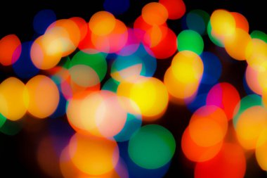 Soyut renkli, odaklanmış dairesel fakül. Bokeh bulanık renk ışığı arka planı kullanabilir. Yeni yıl Bokeh feshi