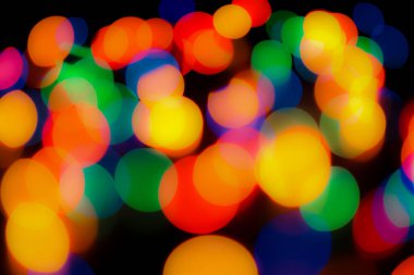 Soyut renkli, odaklanmış dairesel fakül. Bokeh bulanık renk ışığı arka planı kullanabilir. Yeni yıl Bokeh feshi