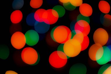 Soyut renkli, odaklanmış dairesel fakül. Bokeh bulanık renk ışığı arka planı kullanabilir. Yeni yıl Bokeh feshi