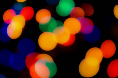 Soyut renkli, odaklanmış dairesel fakül. Bokeh bulanık renk ışığı arka planı kullanabilir. Yeni yıl Bokeh feshi