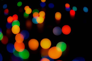 Soyut renkli, odaklanmış dairesel fakül. Bokeh bulanık renk ışığı arka planı kullanabilir. Yeni yıl Bokeh feshi