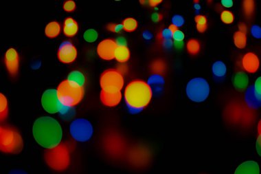 Soyut renkli, odaklanmış dairesel fakül. Bokeh bulanık renk ışığı arka planı kullanabilir. Yeni yıl Bokeh feshi