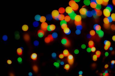 Soyut renkli, odaklanmış dairesel fakül. Bokeh bulanık renk ışığı arka planı kullanabilir. Yeni yıl Bokeh feshi