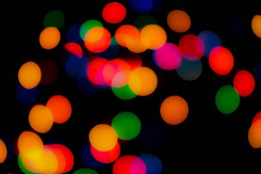 Soyut renkli, odaklanmış dairesel fakül. Bokeh bulanık renk ışığı arka planı kullanabilir. Yeni yıl Bokeh feshi