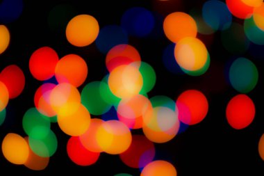 Soyut renkli, odaklanmış dairesel fakül. Bokeh bulanık renk ışığı arka planı kullanabilir. Yeni yıl Bokeh feshi