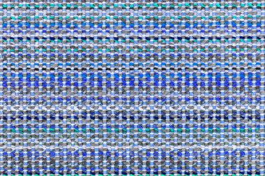 Çok renkli örgü kumaş arkaplan dokusu. Renkli kırmızı kumaş ve bir deseni var. Parça renkli yün halı, parlak hasır renkli halı.