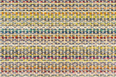 Çok renkli örgü kumaş arkaplan dokusu. Renkli kırmızı kumaş ve bir deseni var. Parça renkli yün halı, parlak hasır renkli halı.