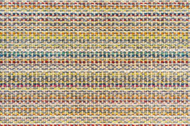 Çok renkli örgü kumaş arkaplan dokusu. Renkli kırmızı kumaş ve bir deseni var. Parça renkli yün halı, parlak hasır renkli halı.