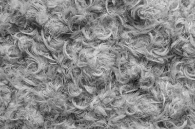 Beyaz kaz tüyleri ve yastık dokusundan tüyler.