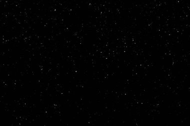 Siyah arka planda beyaz bir bokeh. Işık lekesi dokusu. Kar yağıyor. yıldız gökyüzü.