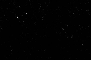 Siyah arka planda beyaz bir bokeh. Işık lekesi dokusu. Kar yağıyor. yıldız gökyüzü.