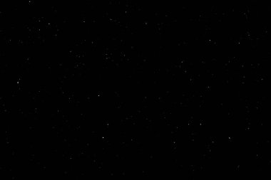 Siyah arka planda beyaz bir bokeh. Işık lekesi dokusu. Kar yağıyor. yıldız gökyüzü.