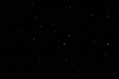 Siyah arka planda beyaz bir bokeh. Işık lekesi dokusu. Kar yağıyor. yıldız gökyüzü.