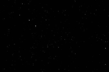 Siyah arka planda beyaz bir bokeh. Işık lekesi dokusu. Kar yağıyor. yıldız gökyüzü.