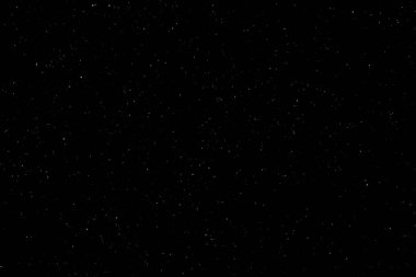 Siyah arka planda beyaz bir bokeh. Işık lekesi dokusu. Kar yağıyor. yıldız gökyüzü.