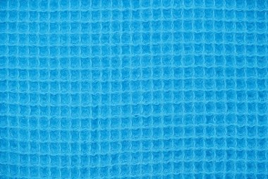 Örgü yün kumaş arka planının mavi doğal dokusu. Pamuk kumaş, dokuma bezi dokusu.