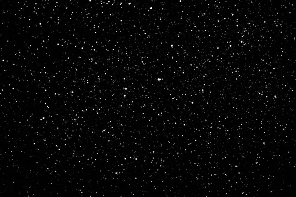 无序的白星在孤立的黑色背景上倾斜 飘落的雾蒙蒙的雪花覆盖着 星空闪烁 黑色背景上的白斑 白色水滴和白斑 — 图库照片