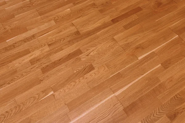 Brown laminate floor texture background. natural wooden polished surface parquet