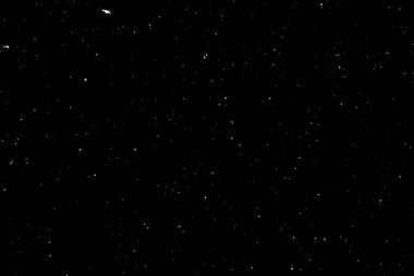 Siyah arka planda beyaz bir bokeh. Işık lekesi dokusu. Kar yağıyor. yıldız gökyüzü