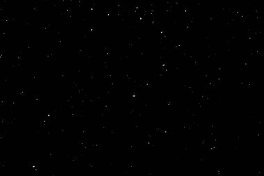 Siyah arka planda beyaz bir bokeh. Işık lekesi dokusu. Kar yağıyor. yıldız gökyüzü