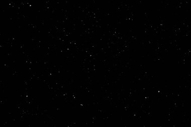 Siyah arka planda beyaz bir bokeh. Işık lekesi dokusu. Kar yağıyor. yıldız gökyüzü