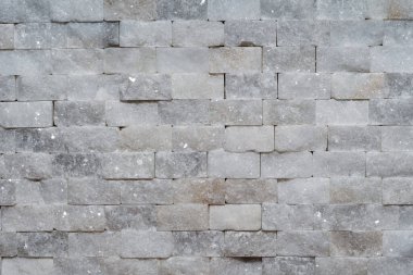 Beyaz modern dekoratif doğal taş içerisi için. Panel duvarı küçük mermer tuğla arka plan dokusu dekoratif desenli kuvars taşı mozaiği. Odanın iç dekorasyonu.