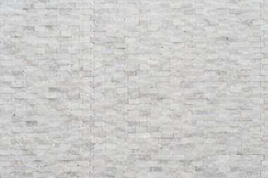 Beyaz modern dekoratif doğal taş içerisi için. Panel duvarı küçük mermer tuğla arka plan dokusu dekoratif desenli kuvars taşı mozaiği. Odanın iç dekorasyonu.