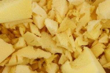 Sarı poliüretan köpük plastik arka plan dokusu. Yastık ve mobilya doldurma