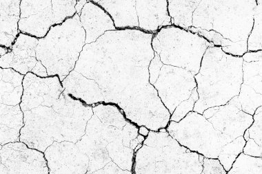 White dried and cracked ground. erosion earth background. cracked dry wall surface. white natural cracked texture clipart