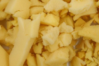 Sarı poliüretan köpük plastik arka plan dokusu. Yastık ve mobilya doldurma