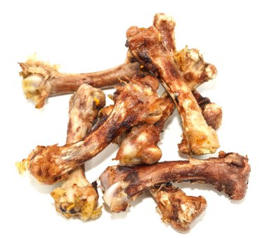 Beyaz arka planda küçük kemikler. Yemek artıkları. tavuk kemikleri