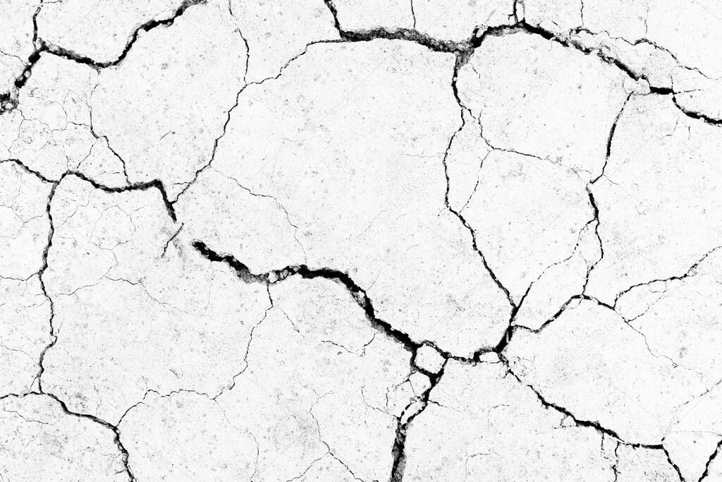 White dried and cracked ground. erosion earth background. cracked dry wall surface. white natural cracked texture