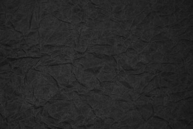 Siyah buruşmuş ambalaj kağıdı arka plan dokusu. Koyu Kraft Kağıt Kaba. Kırışık kese kağıdı.
