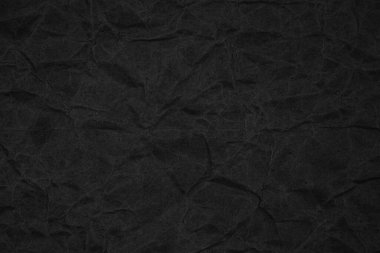 Siyah buruşmuş ambalaj kağıdı arka plan dokusu. Koyu Kraft Kağıt Kaba. Kırışık kese kağıdı.