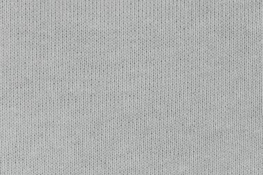 Örgü yün kumaş arka planının beyaz doğal dokusu. Beyaz pamuk kumaş, örülmüş tuval dokusu