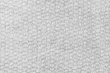 Örgü yün kumaş arka planının beyaz doğal dokusu. Beyaz pamuk kumaş, örülmüş tuval dokusu