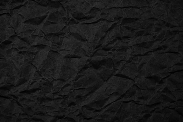 Siyah buruşmuş ambalaj kağıdı arka plan dokusu. Koyu Kraft Kağıt Kaba. Kırışık kese kağıdı.