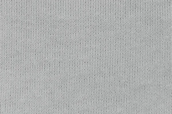Örgü yün kumaş arka planının beyaz doğal dokusu. Beyaz pamuk kumaş, örülmüş tuval dokusu