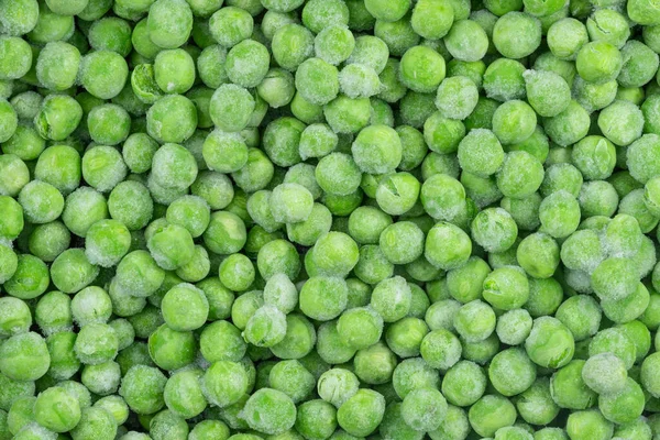 冻绿豌豆质感背景 食物结构的冰豌豆背景 生蔬菜 — 图库照片