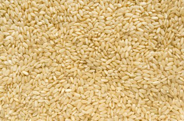 Kahverengi pirinç arkaplan dokusu, sarı uzun tahıl doğal pirinç, yasemin pirinci yakın plan.