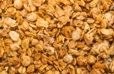 Fırınlanmış sarı müsli arka plan, mısır gevreği dokusu yakın çekim